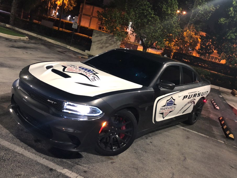 @miamiexoticautoracing x @darkhorsemiami Pursuit car partial wrap on this Hellcat. Check it out at @miamiexoticautoracing Miami's Vehicle Wrap Specialist – Call Us Today!! @tr3performance !!!! . . . . . . . . . . . . #carlifestyle #hellcat #hellcatcharger #charger #cars #sportscar #musclecars #carsofinstagram #pursuit #miami #miamiexoticautoracing #modcar #srt #dodge #racing #performancecar #wrap #vinyl #carwrap #redwhiteandblue #police #customcars #carenthusiast #design #graphicdesign #print #chargerfam #carlovers #rims #miamilife